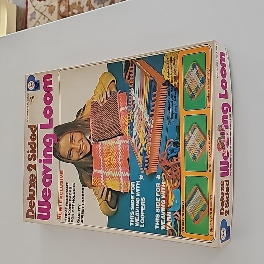 1970's weaving loom with iron on backing, loom and some loopers.